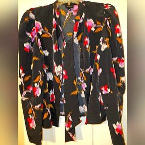 Tie at the neck blouse. Cuffed sleeves with buttons.